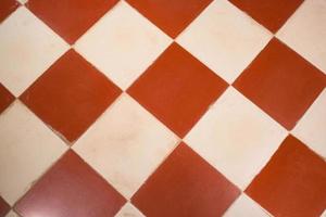 Background. Flooring pattern with white and brick color tiles. photo