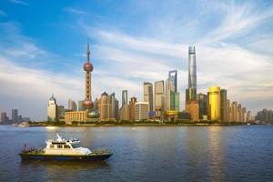 Skyline of Pudong district by Huangpu River in Shanghai, China photo