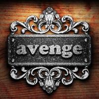 avenge word of iron on wooden background photo