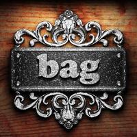 bag word of iron on wooden background photo