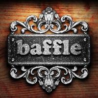 baffle word of iron on wooden background photo