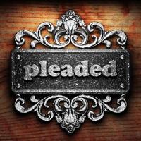 pleaded word of iron on wooden background photo
