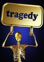 tragedy word and golden skeleton photo