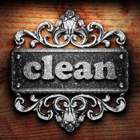 clean word of iron on wooden background photo