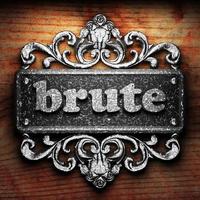 brute word of iron on wooden background photo