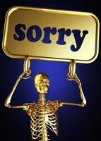 sorry word and golden skeleton photo