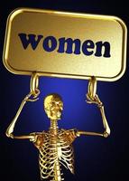palabra de mujer y esqueleto dorado foto