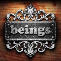 beings word of iron on wooden background photo