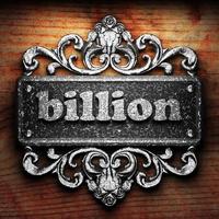 billion word of iron on wooden background photo