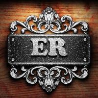 ER word of iron on wooden background photo