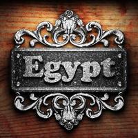 Egypt word of iron on wooden background photo