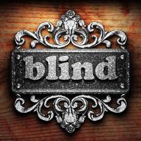 blind word of iron on wooden background photo