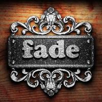 fade word of iron on wooden background photo