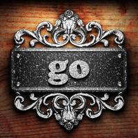 go word of iron on wooden background photo