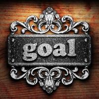 goal word of iron on wooden background photo