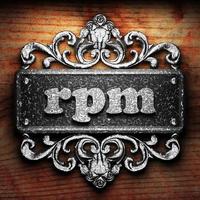 rpm word of iron on wooden background photo