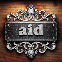 aid word of iron on wooden background photo