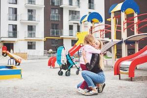 mother with child on the playground photo