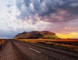 Road in mountains. Bridge over a channel connecting Jokulsarlon Lagoon and Atlantic Ocean in southern Iceland photo