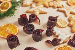 Decorating gingerbread cookies with white icing, selective focus and place for text photo