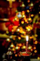 Christmas holiday with candle and tree decoration indoors. Season celebration home party in winter season. Indoor party event ornament happy festive time. No people.