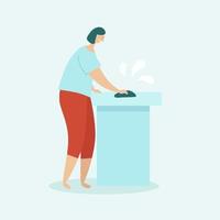 Woman cleaning the house. Housewife washing the table with a rag. The concept of home cleaning and cleanliness. Flat vector illustration on a light blue background.