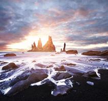 Iceland, Jokulsarlon lagoon, Beautiful cold landscape picture of icelandic glacier lagoon bay, The Rock Troll Toes. Reynisdrangar cliffs. photo