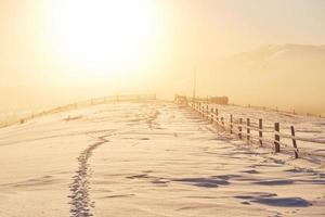 the winter road. Dramatic scene. Carpathian Ukraine photo