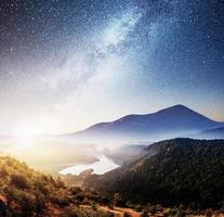 Mountain beautiful landscape with river views, vibrant night sky