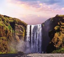 Great waterfall Skogafoss in south of Iceland near the town of Skogar. Dramatic and picturesque scene photo