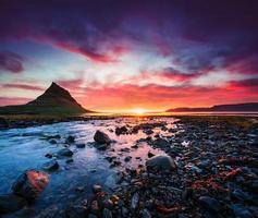 The picturesque sunset over landscapes and waterfalls. Kirkjufell mountain photo
