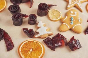 Decorating gingerbread cookies with white icing, selective focus and place for text photo