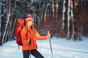 Woman Traveler with backpack hiking Travel Lifestyle adventure concept active vacations outdoor. Beautiful landscape  forest photo