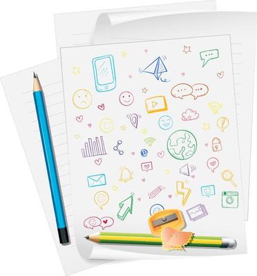 Hand drawn doodle icons on paper with pencils