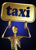 palabra taxi y esqueleto dorado foto