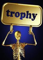 palabra trofeo y esqueleto dorado foto