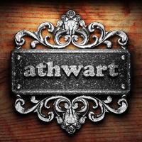 athwart word of iron on wooden background photo