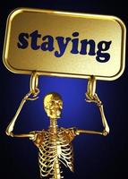 staying word and golden skeleton photo