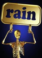 palabra lluvia y esqueleto dorado foto