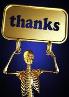 gracias palabra y esqueleto dorado foto