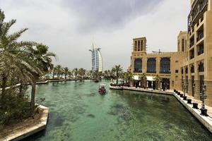 Dubai, UAE, May 8, 2015 - View at hotel Burj al Arab from Madinat Jumeirah in Dubai. Madinat Jumeirah encompasses two hotels and clusters of 29 traditional Arabic houses. photo