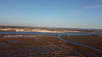 Aerial drive view of salt fields in Castro Marim, Portugal. Sunset cinematic shot. Nice vibrant colors. Salt extraction. video