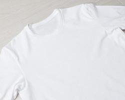 Blank white T-shirt mockup template on the floor photo