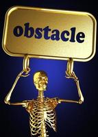 palabra obstáculo y esqueleto dorado foto