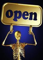 palabra abierta y esqueleto dorado foto