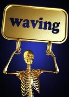 waving word and golden skeleton photo