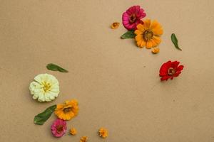 Beautiful flower flat lay arrangement on brown background. Flat lay bouquet, top view, overhead, empty space for copied text. photo