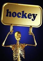 palabra de hockey y esqueleto dorado foto