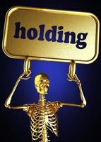 holding word and golden skeleton photo