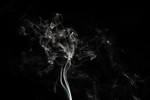 Smoke effect texture. Isolated background. Black and dark backdrop. Smokey fire and mistic effect. photo